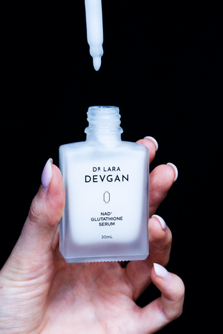 Dr. Lara Devgan NAD+ Glutathione Serum, applied to the face and neck