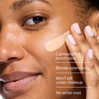 Model blending EltaMD UV Daily Hydration+ Tinted SPF 50 sunscreen into her cheek