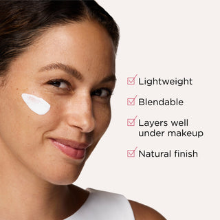 Model applying a layer of EltaMD UV Daily Hydration+ SPF 50 sunscreen to her cheek