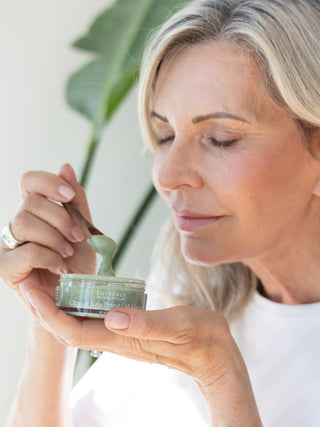 Eminence Citrus & Kale Potent C+E Masque, shown in use during application