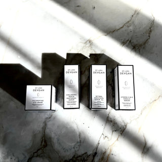 Dr. Lara Devgan Anti-Aging Essentials boxes on marble