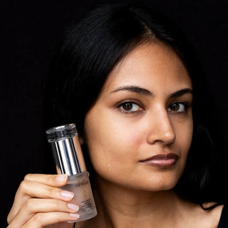 Model holding Dr. Lara Devgan serum from the Glass Skin Protocol