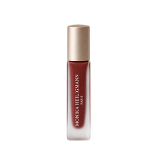 Monika Heiligmann Elixir de Volume No. 9 Midnight in Paris lip serum on a white background