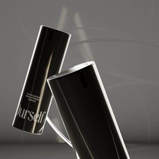 Two Ourself Complexion Brightening Serum bottles on a dark stylized set