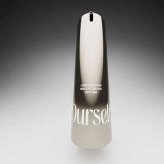 Ourself Complexion Brightening Serum bottle lit in a studio spotlight