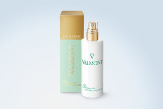 Valmont Priming with a Hydrating Fluid in use on the face